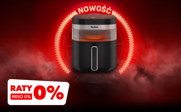 Czarny sprzęt kuchenny z przezroczystą górną częścią, na której widnieje logo Tefal, otoczony czerwonymi efektami świetlnymi i napisem Nowość u góry. W lewym dolnym rogu znajduje się biało-czerwony prostokąt z napisem: Raty 0% RRSO 0%.