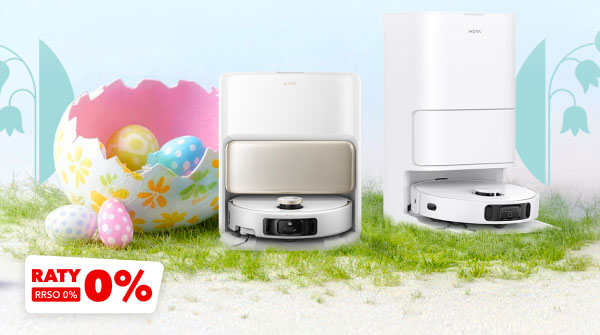 Na zdjęciu znajdują się dwa białe roboty sprzątające na trawie, obok dużej, kolorowej pisanki z mniejszymi pisankami w środku. W lewym dolnym rogu widnieje napis RATY 0%, RRSO 0%.