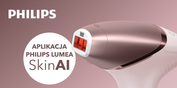 Urządzenie do depilacji w kolorze różowego złota z białymi elementami, z widocznym czerwonym okienkiem emitującym światło. Obok znajduje się napis Philips oraz okrągły biały element z tekstem: Aplikacja Philips Lumea ShinAI.