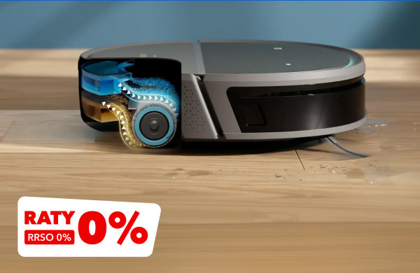 Robot sprzątający na drewnianej podłodze, z widocznym przekrojem ukazującym jego wewnętrzne mechanizmy, takie jak szczotki i koła. W lewym dolnym rogu widnieje napis: Raty 0%, RRSO 0%.