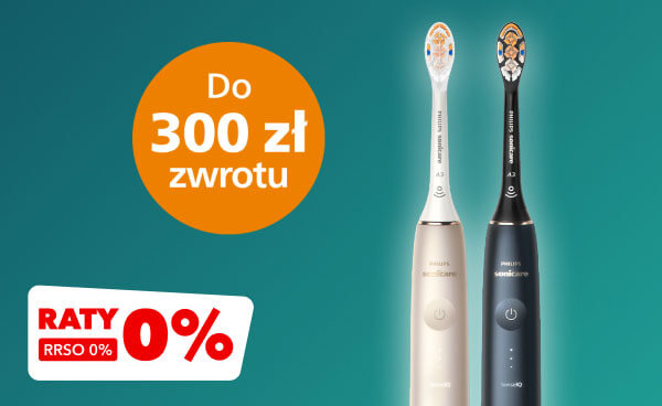 Dwie elektryczne szczoteczki do zębów w kolorach złotym i czarnym stoją na tle zielonej ściany. Obok nich znajduje się pomarańczowe koło z napisem Do 300 zł zwrotu oraz biały prostokąt z czerwonym napisem RATY 0%, RRSO 0%.