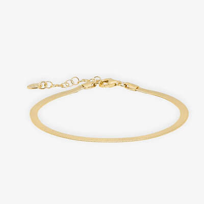 Gold herringbone bracelet with lobster clasp and adjustable chain on white background